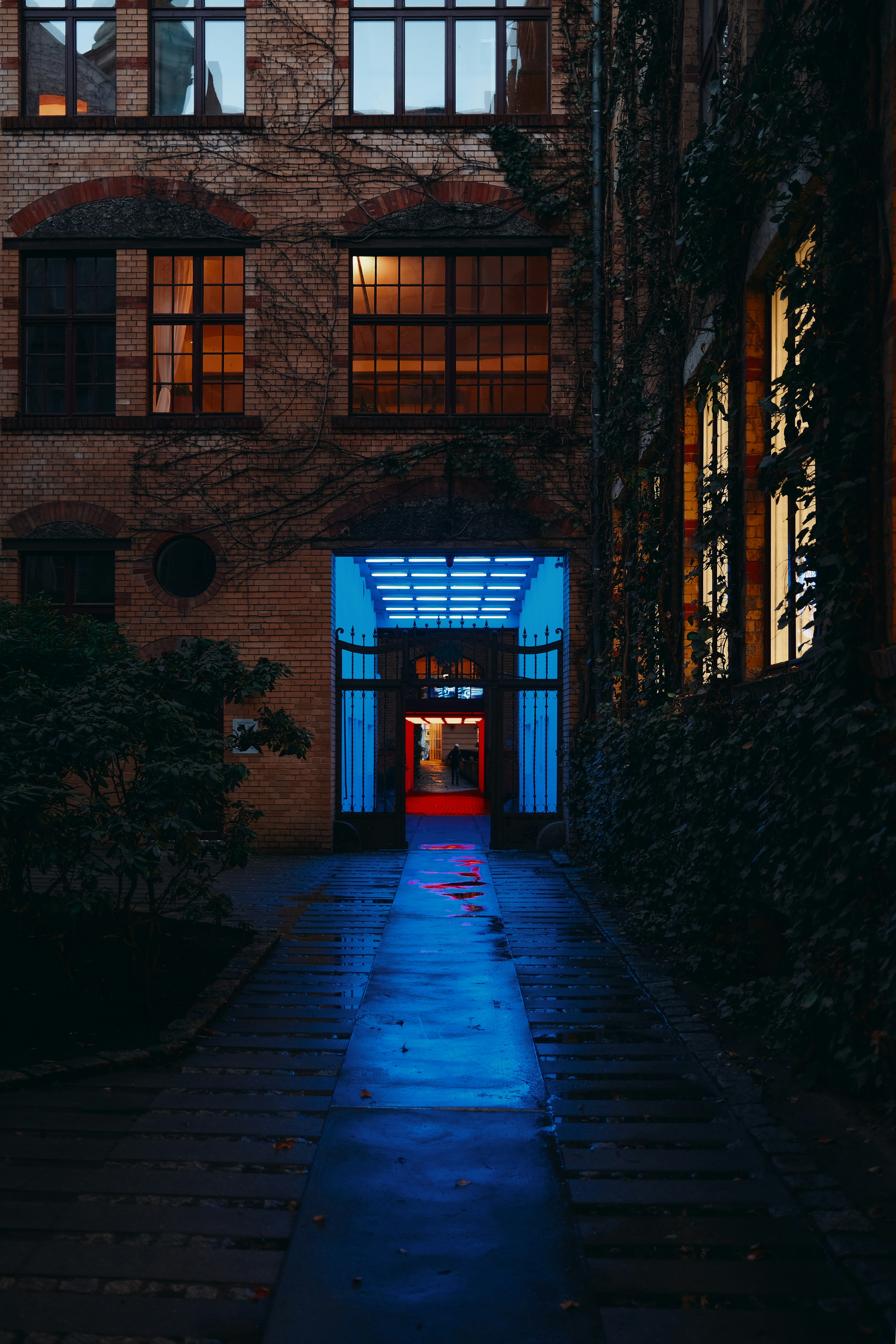 brown brick building with blue door
